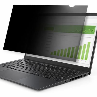 A laptop with a privacy filter attached, shown at an angle with the screen darkened from the side and a chart visible head-on
