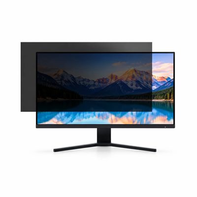 A desktop monitor with a privacy filter panel being fitted, the screen darkened from the side and clear head-on