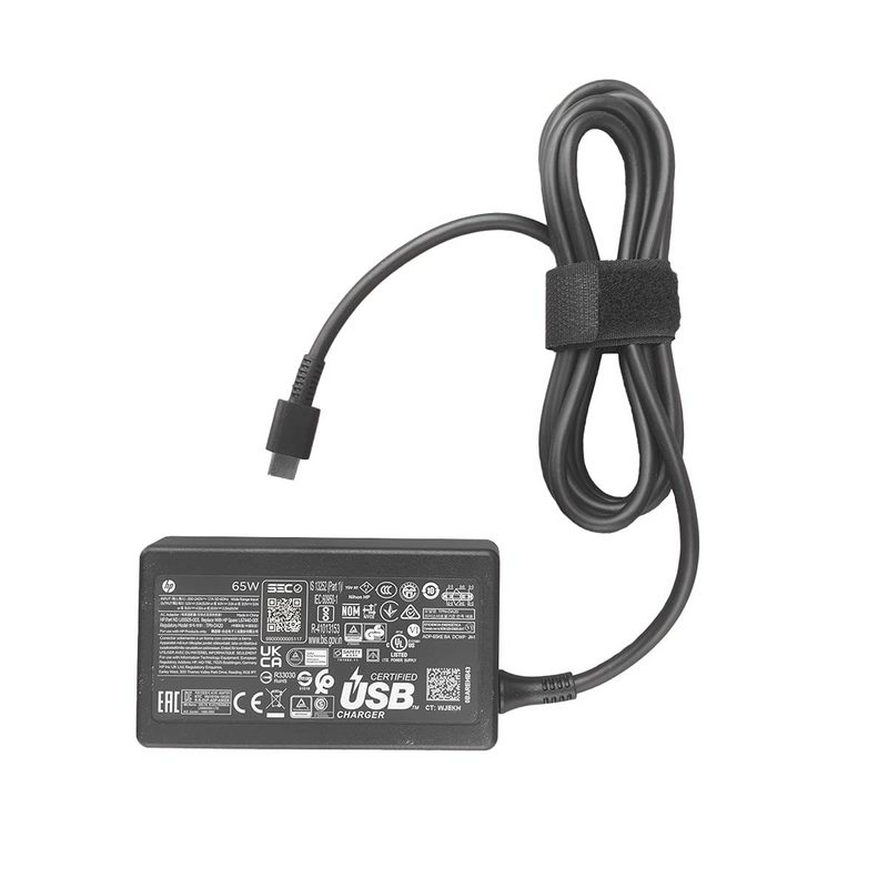 A black HP 65W USB-C laptop adapter with a coiled cable held by a Velcro strap and a USB-C connector