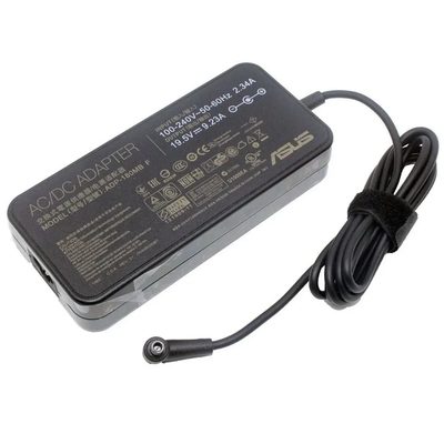 A black ASUS 180W AC/DC adapter with a rating label and a cable held by a Velcro strap